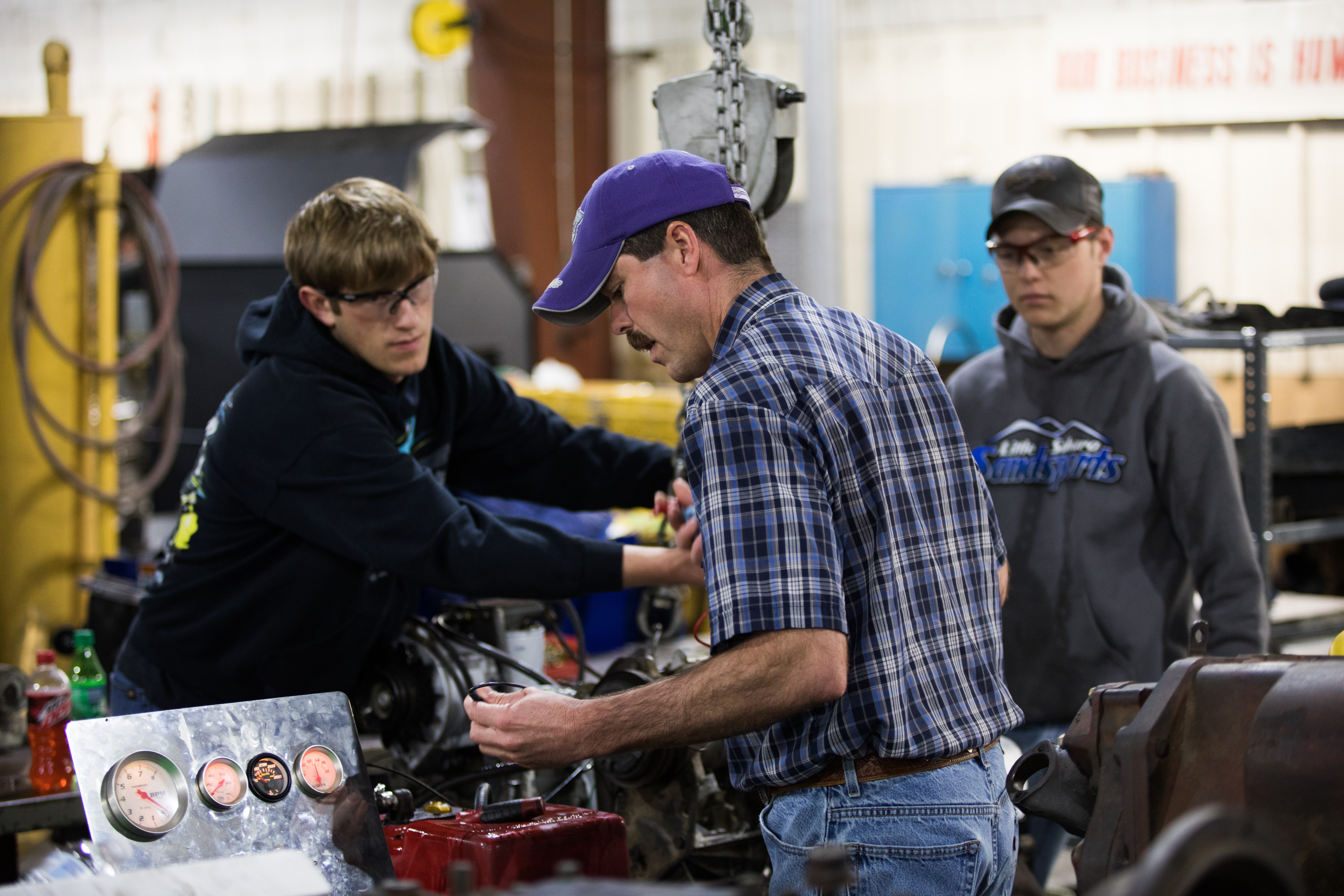 Professor Colby Kline works with the students in the Diesle Technology program at DC3
