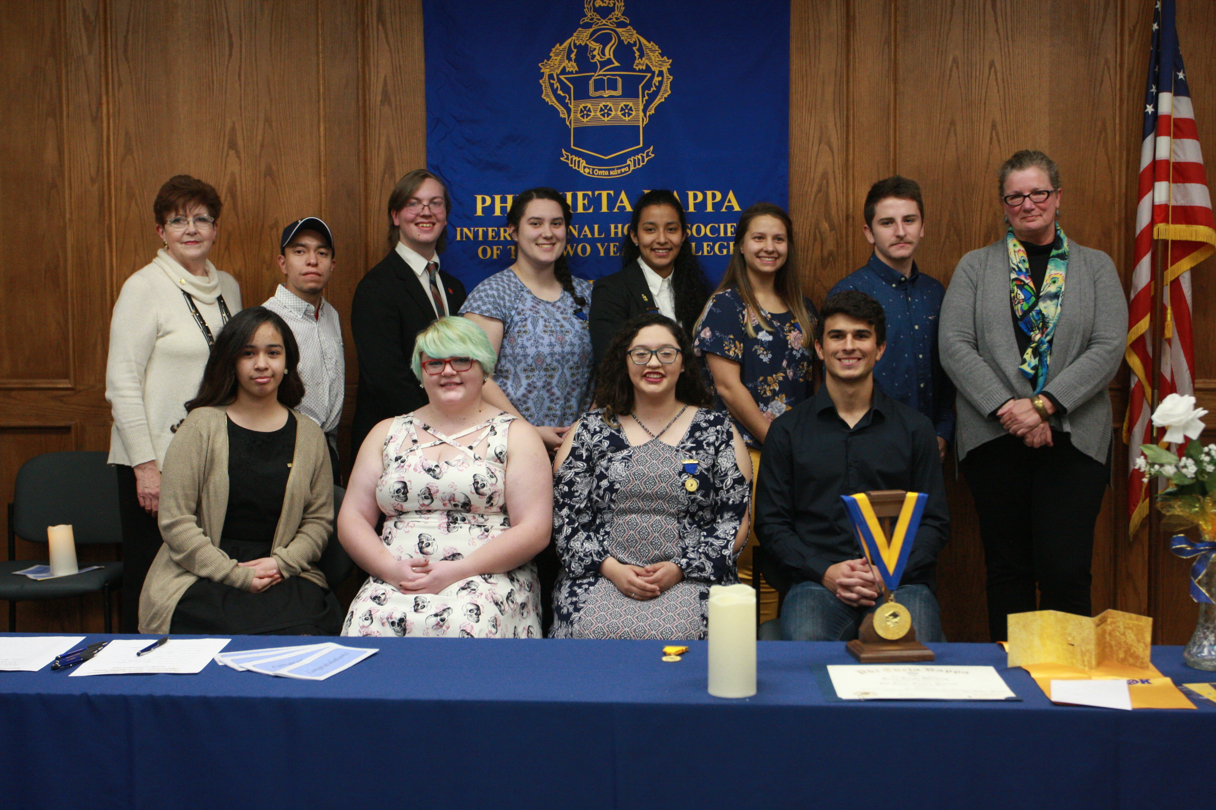 Kappa Psi new inductees posing with advisors