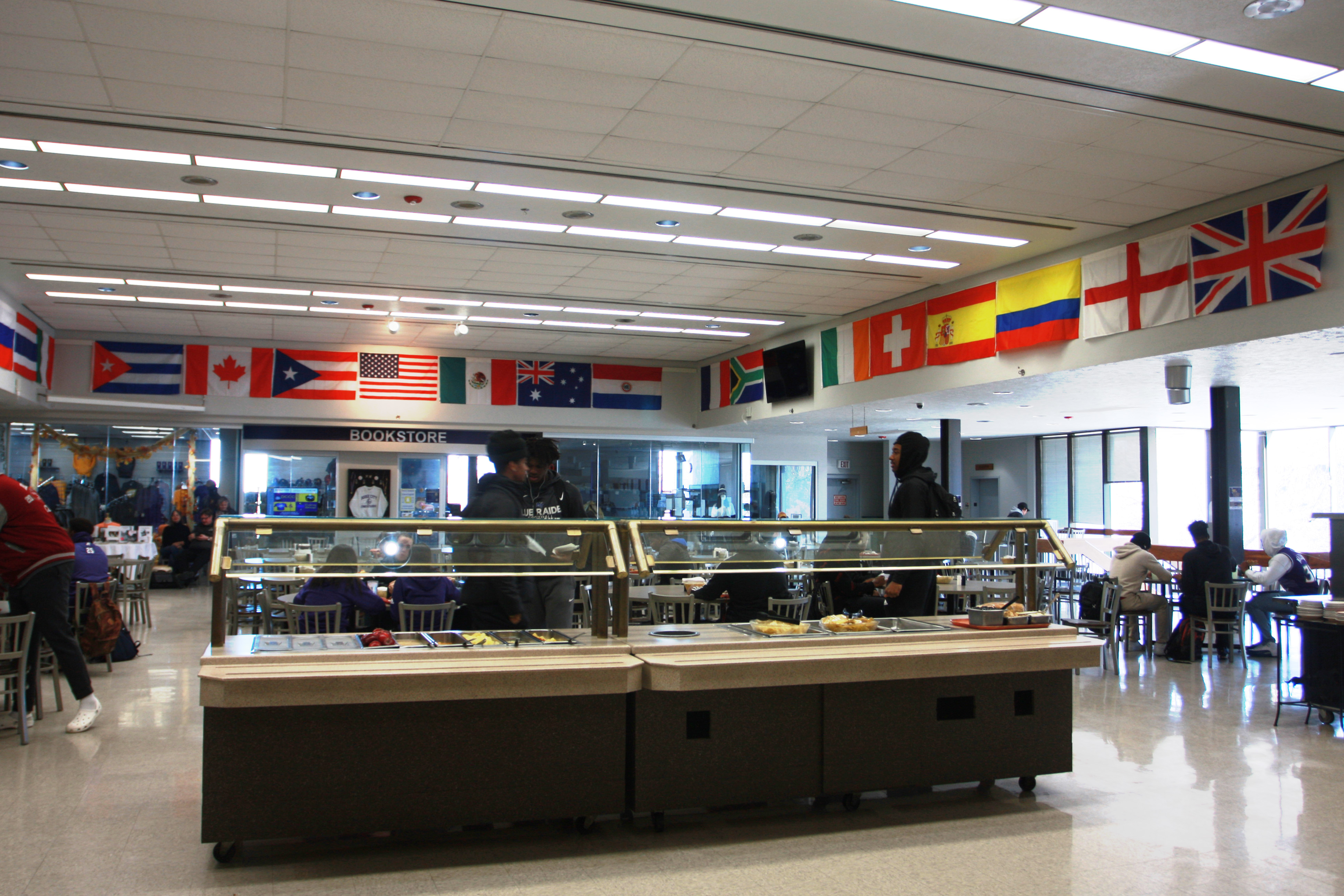 Photo of international flags from over 23 countries on display in the DC3 cafeteria