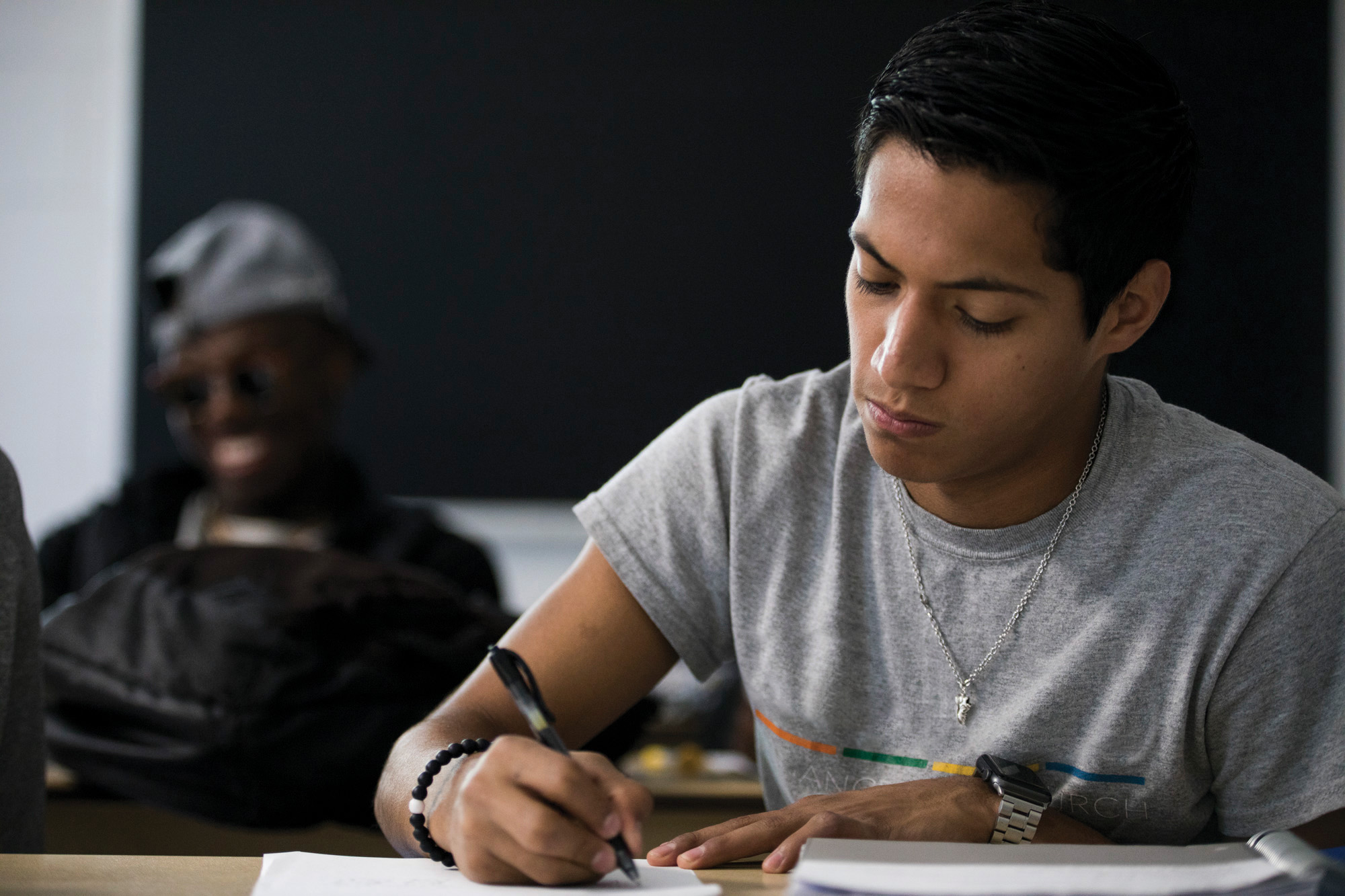 DC3 Student at desk writing