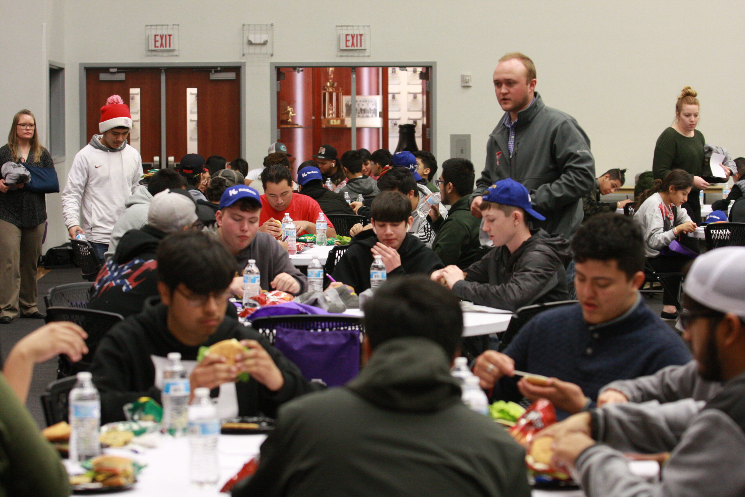 DCHS students eating and completing information cards during lunch on ag & diesel day