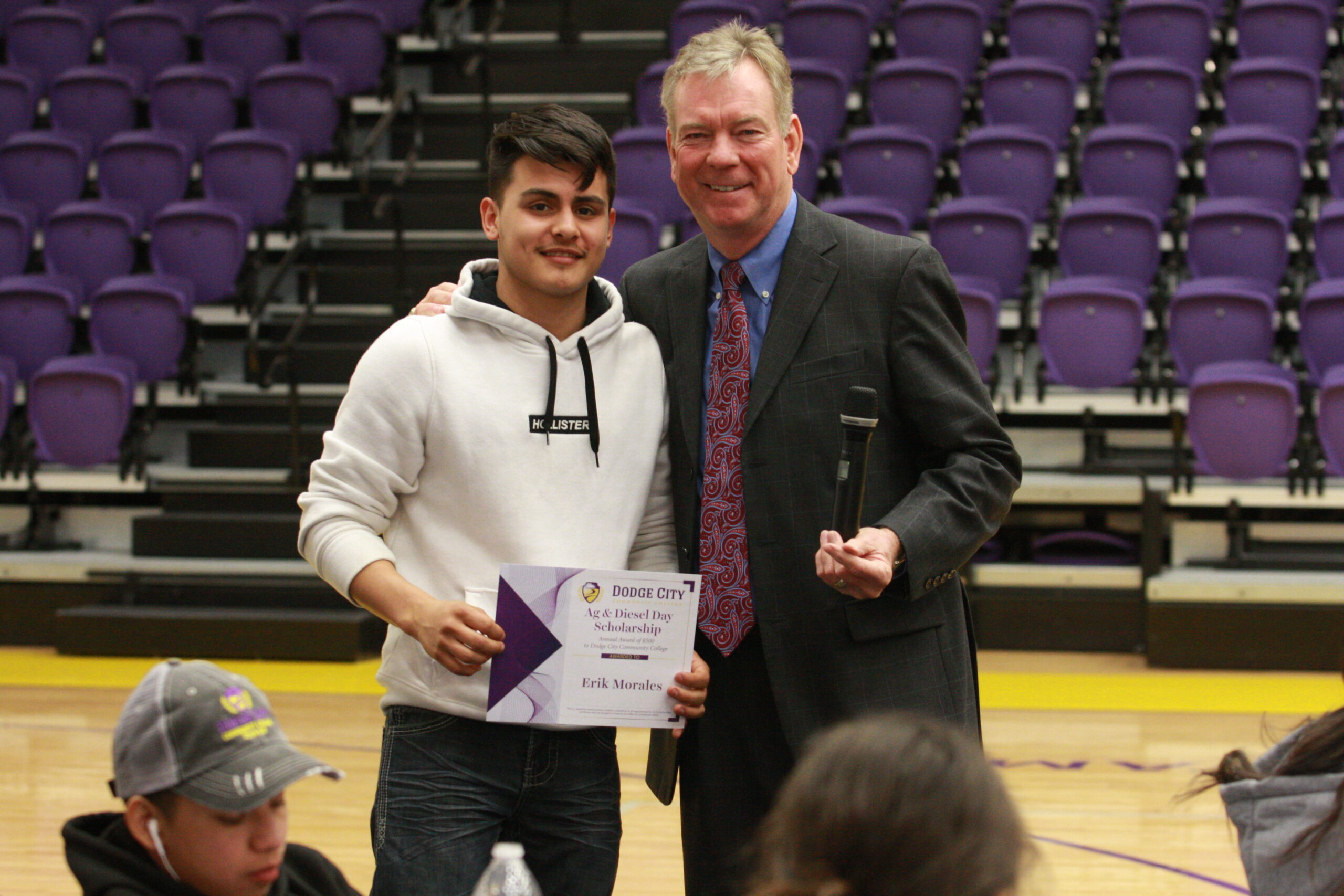 DCHS student Erik Morales poses with Dr. Harold Nolte, president of DC3 after receiving a scholarship for ag & diesel day